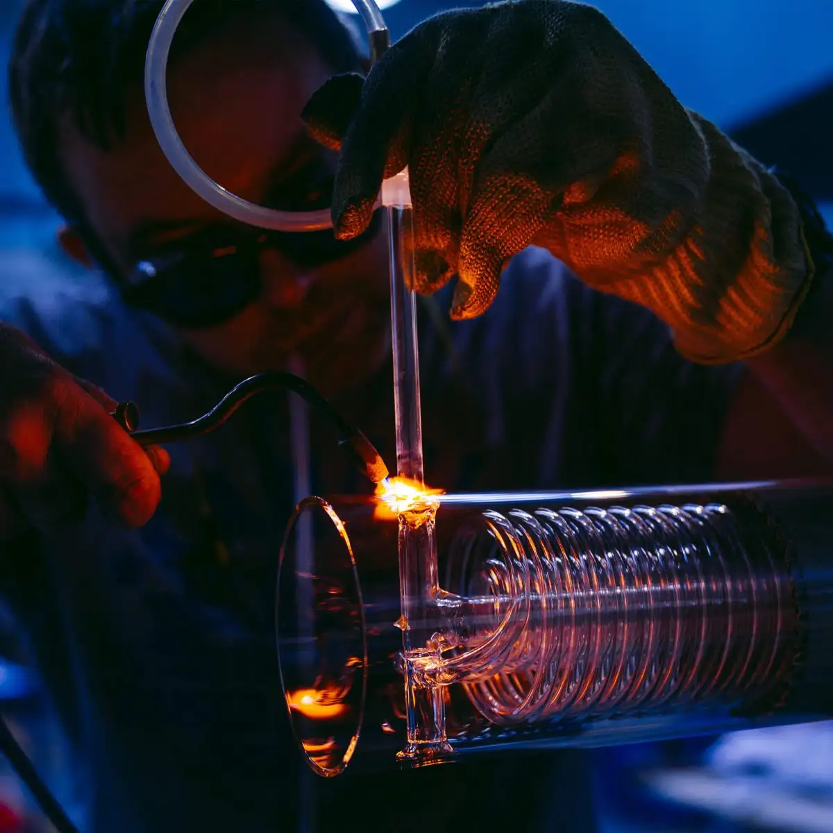 A glassblower working on a laboratory borosilicate glass at Cambridge Glassblowing